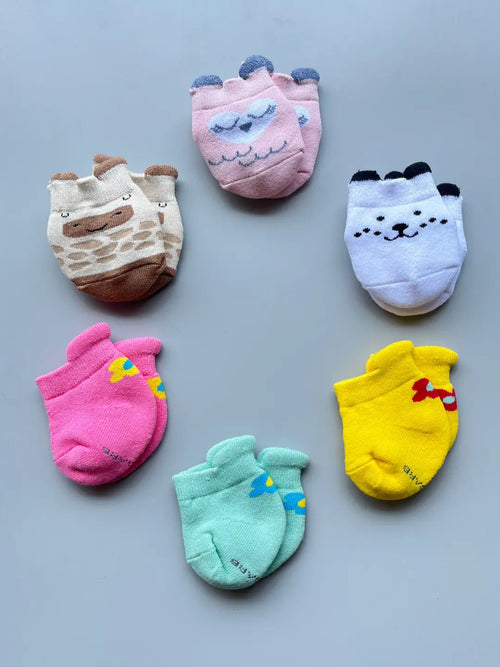Air Garb baby combo socks for infants 0-1 years; a 6-pair collection of soft cotton socks featuring pink owl, brown giraffe, white puppy, and colorful flower designs in mint, yellow, and pink.